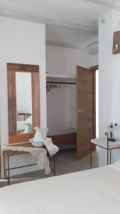 Rúm í herbergi á B&B Sperlonga