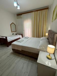 Postel nebo postele na pokoji v ubytování Dadaj Apartments