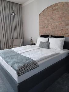Posteľ alebo postele v izbe v ubytovaní Apartamenty "BULWAR GORZOW"