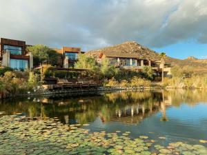 a river with some buildings and some water at Bruma Wine Resort in Valle de Guadalupe +113 photos