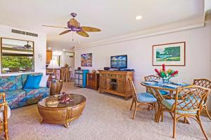 a living room with a couch and a table at Maui Eldorado - G108 - Stay in the Heart of Kaanapali in Kahana