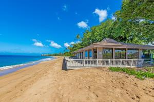 a gazebo on a beach next to the ocean at Maui Eldorado - G108 - Stay in the Heart of Kaanapali in Kahana