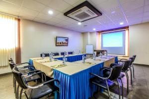 a conference room with a long table and chairs at The Monarch Boutique Hotel in Nairobi