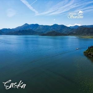a view of a lake with mountains in the background at Apartmani Konoba Starčevo in Virpazar