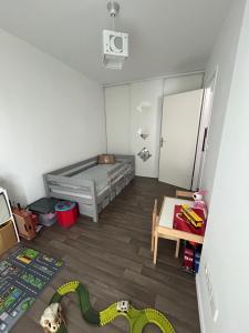 Ένα ή περισσότερα κρεβάτια σε δωμάτιο στο Superbe appartement +3 φωτογραφίες