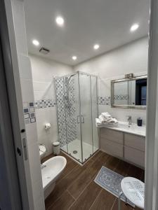 a bathroom with a shower and a sink and a toilet at L Arcolaio in San Maurizio dʼOpaglio +8 photos