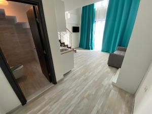 TV a/nebo společenská místnost v ubytování Sunny Beach Potos