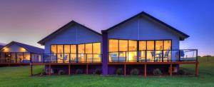 a large blue house with a lot of windows at Horizon Deluxe Apartments in Stanley