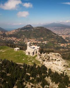 an old building on top of a hill at La Cantina di Alba & Tramonto in Pimonte