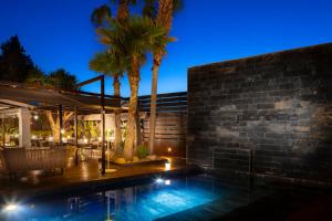 a house with a swimming pool at night at Hotel Boutique Ses Pitreras in San Antonio Bay
