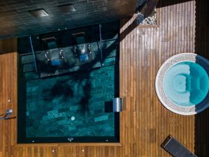an overhead view of a swimming pool in a bathroom at Hotel Boutique Ses Pitreras in San Antonio Bay