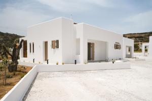 a rendering of a white house with a courtyard at Calma Residences in Skiros