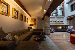 a living room with a couch and a fireplace at 1850 Hotel Boutique in Guanajuato