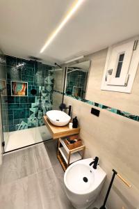 a bathroom with a toilet and a sink and a shower at Frida Luxury B&B in Vietri sul Mare
