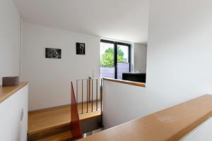 a living room with a table and a window at Ferienwohnung Heimathafen in Wester-Ohrstedt