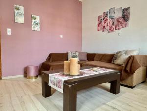 a living room with a couch and a table at Lamprinis House in Arta