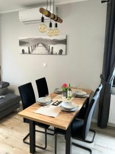 Posedenie v ubytovaní Apartamenty Czarna Perła