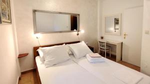 Postel nebo postele na pokoji v ubytování Apartments Marino