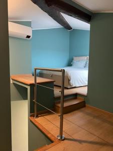 a bedroom with a bed in a blue room at La terrazzina OLTRE HOME HOLIDAYS in Sanremo