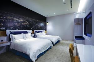 Postel nebo postele na pokoji v ubytování Airline Inn Green Park Way