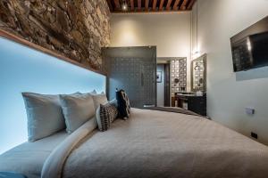 Postel nebo postele na pokoji v ubytování Nueve 25 Hotel Boutique