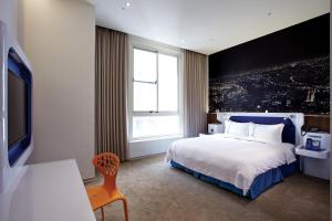 Postel nebo postele na pokoji v ubytování Airline Inn Green Park Way