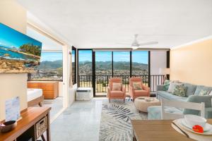 a living room with a couch and a table at Panoramic Mountain View Near Waikiki Beach with Parking in Honolulu +83 photos