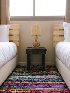 Postel nebo postele na pokoji v ubytování Flo Surf Morocco