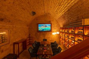 TV a/nebo společenská místnost v ubytování Nueve 25 Hotel Boutique