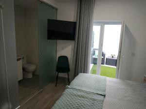 Imagem da galeria de Garden House Fundão - Quartos duplos com WC privativo no Fundão