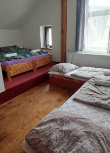 Postel nebo postele na pokoji v ubytování Penzion Harmonie