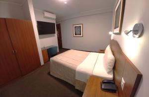 A bed or beds in a room at HOTEL Javier Prado Inn