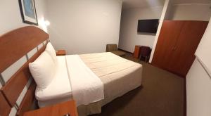 A bed or beds in a room at HOTEL Javier Prado Inn