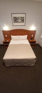 A bed or beds in a room at HOTEL Javier Prado Inn