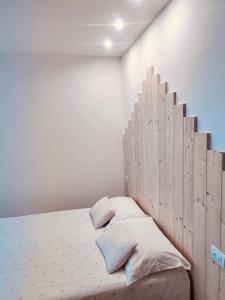 A bed or beds in a room at Gloria Holiday Home Bormio