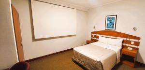 A bed or beds in a room at HOTEL Javier Prado Inn