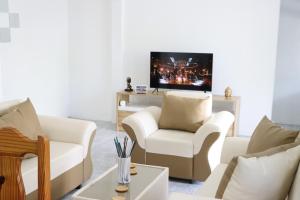 Télévision ou salle de divertissement dans l'établissement Garden Suite