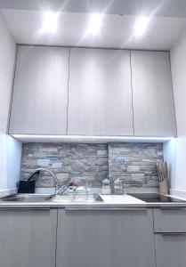 A kitchen or kitchenette at Gloria Holiday Home Bormio