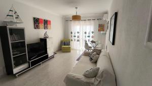TV a/nebo společenská místnost v ubytování Mar e Serra Apartment