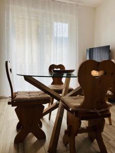A television and/or entertainment centre at Gloria Holiday Home Bormio