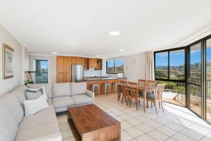 a living room with a couch and a table at San Simeon 33 in Gold Coast