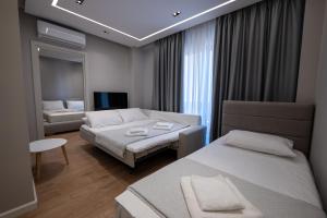 Postel nebo postele na pokoji v ubytování Norge Hotel