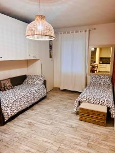 A bed or beds in a room at Gloria Holiday Home Bormio