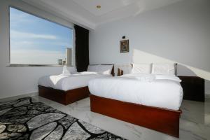 Postel nebo postele na pokoji v ubytování NEW ASSER HOTEL PYRAMID
