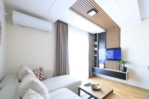 Телевизор и/или развлекательный центр в Apartman North resort