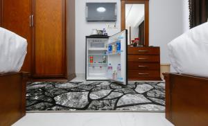 Postel nebo postele na pokoji v ubytování NEW ASSER HOTEL PYRAMID