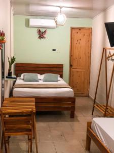 Postel nebo postele na pokoji v ubytování Hostal Síndigo