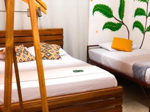 Postel nebo postele na pokoji v ubytování Hostal Síndigo