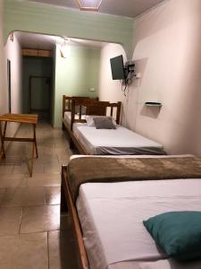 Postel nebo postele na pokoji v ubytování Hostal Síndigo