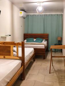 Postel nebo postele na pokoji v ubytování Hostal Síndigo + 14 fotografií